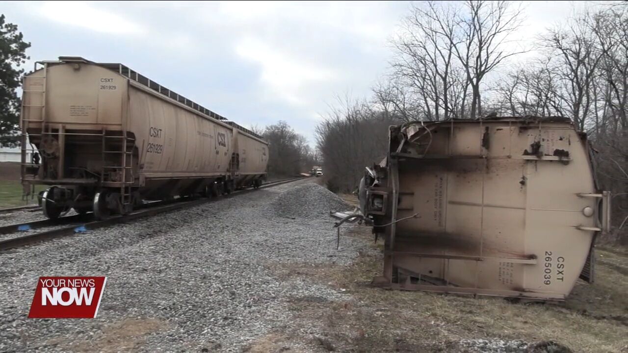 Two train cars carrying corn derailed Wednesday night